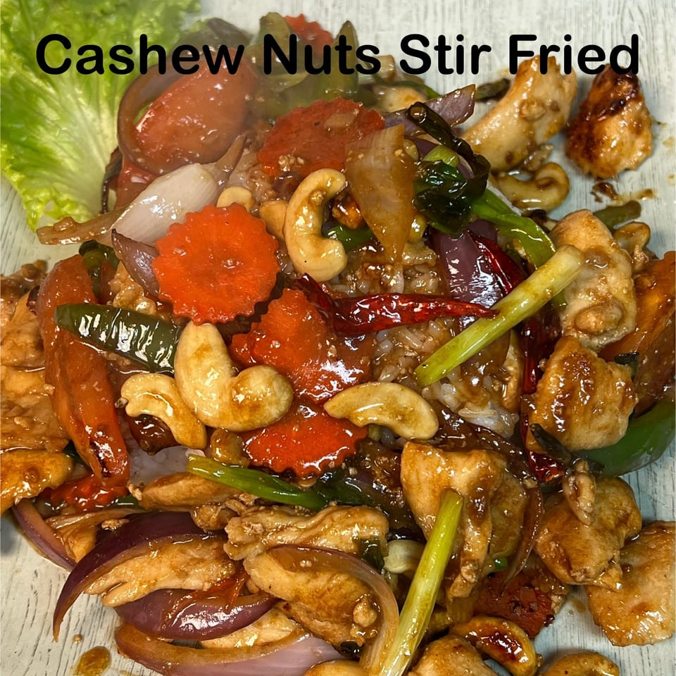 Cashew nuts stir fried with chicken, cashews, carrots, chilies, and scallions over rice.